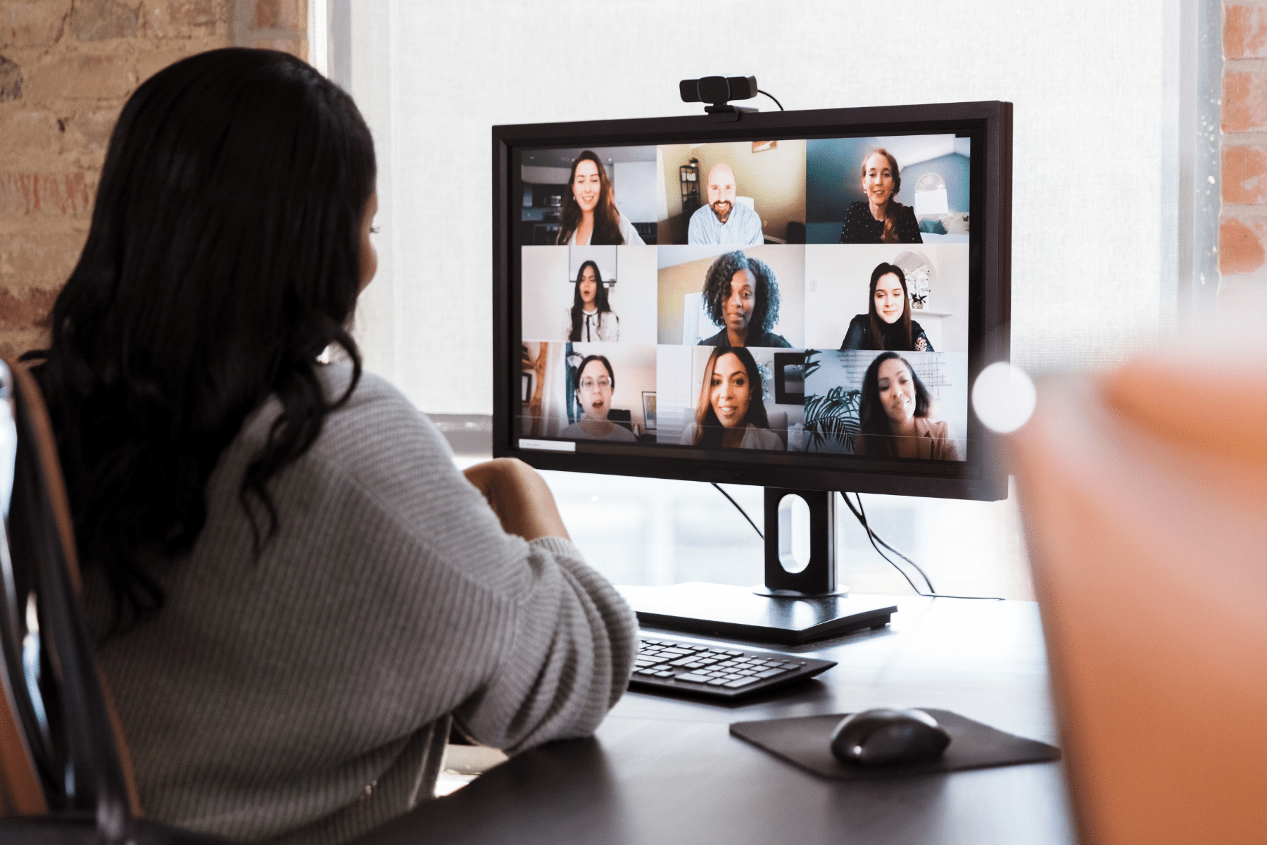 Young woman in a zoom meeting on her laptop