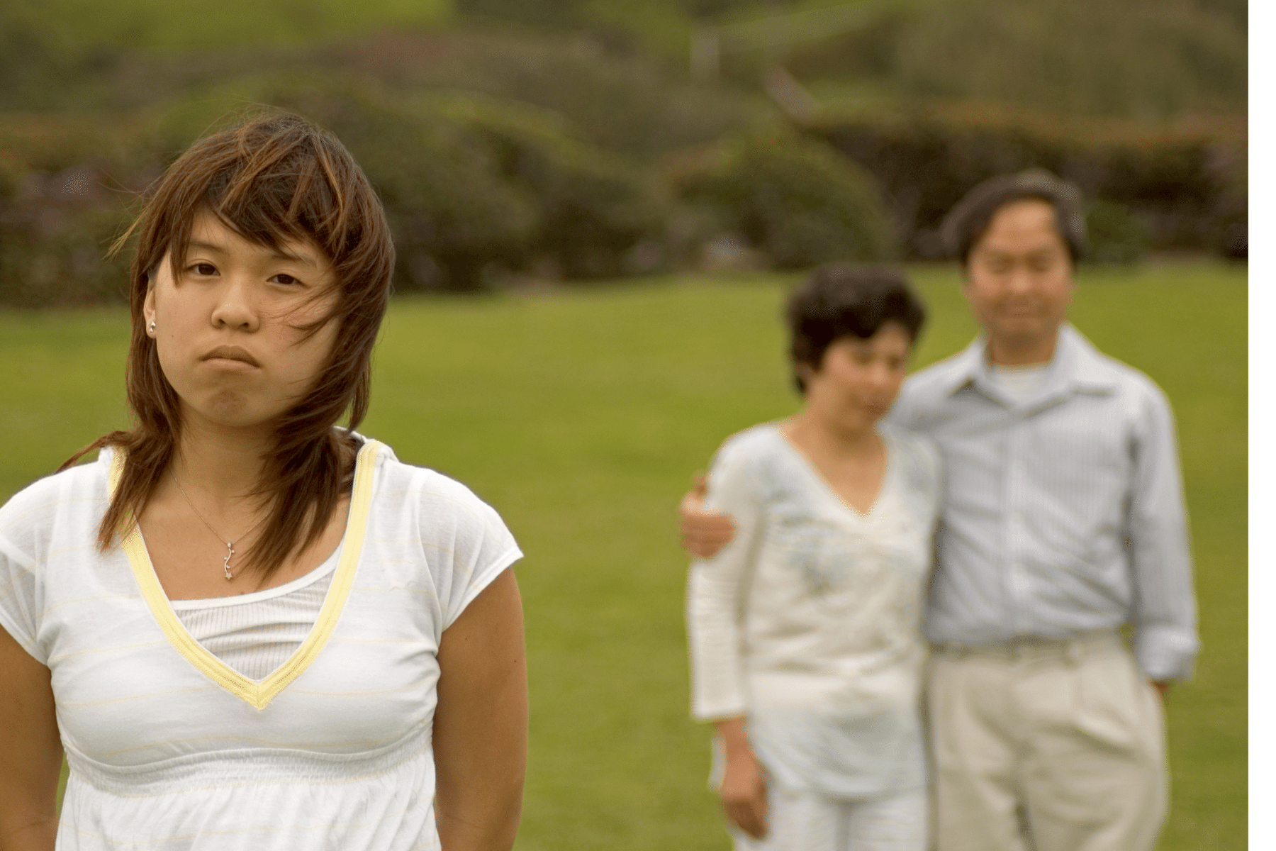 Asian woman having a disagreement with her parents around the topic of difference in expectations