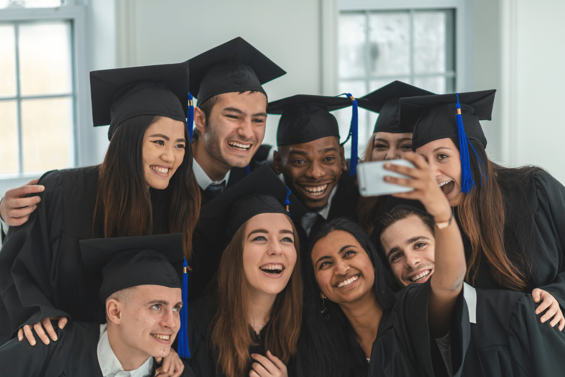 Image depicting resources and undocumented students with graduation caps